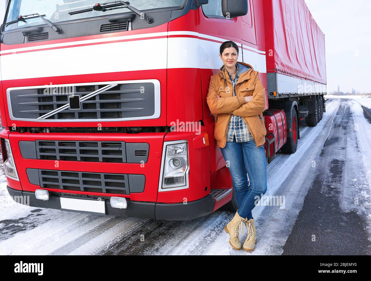 Female driver near big modern truck outdoors Stock Photo - Alamy