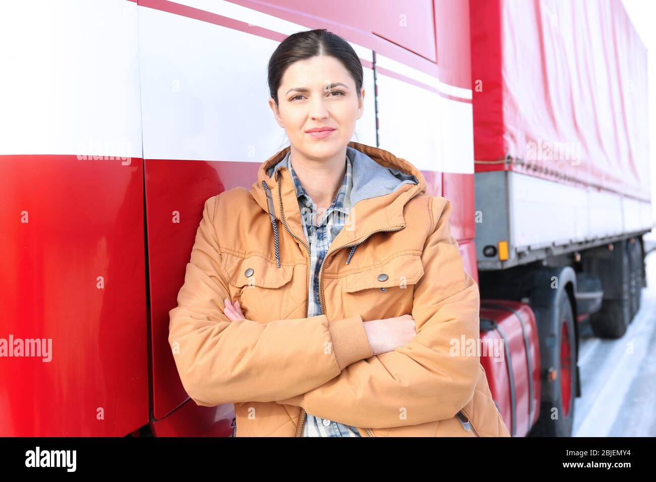 Female driver near big modern truck outdoors Stock Photo - Alamy