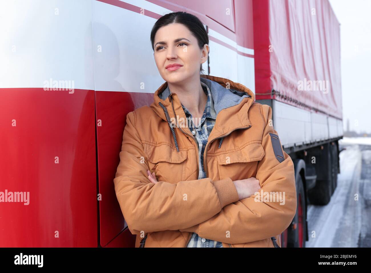 Female driver near big modern truck outdoors Stock Photo - Alamy