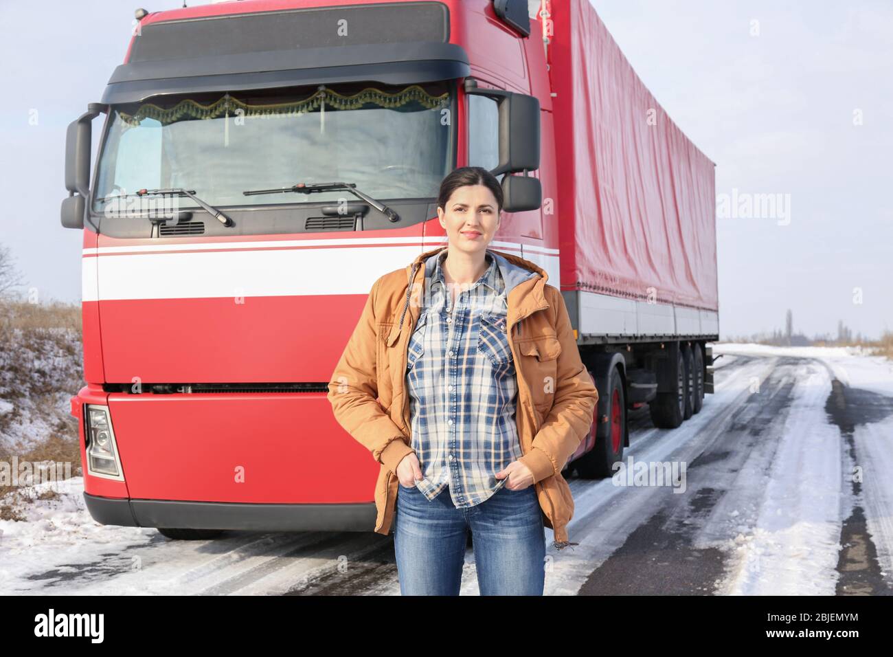 Female driver near big modern truck outdoors Stock Photo - Alamy