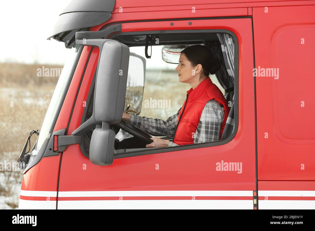 Young woman driving big modern truck Stock Photo - Alamy