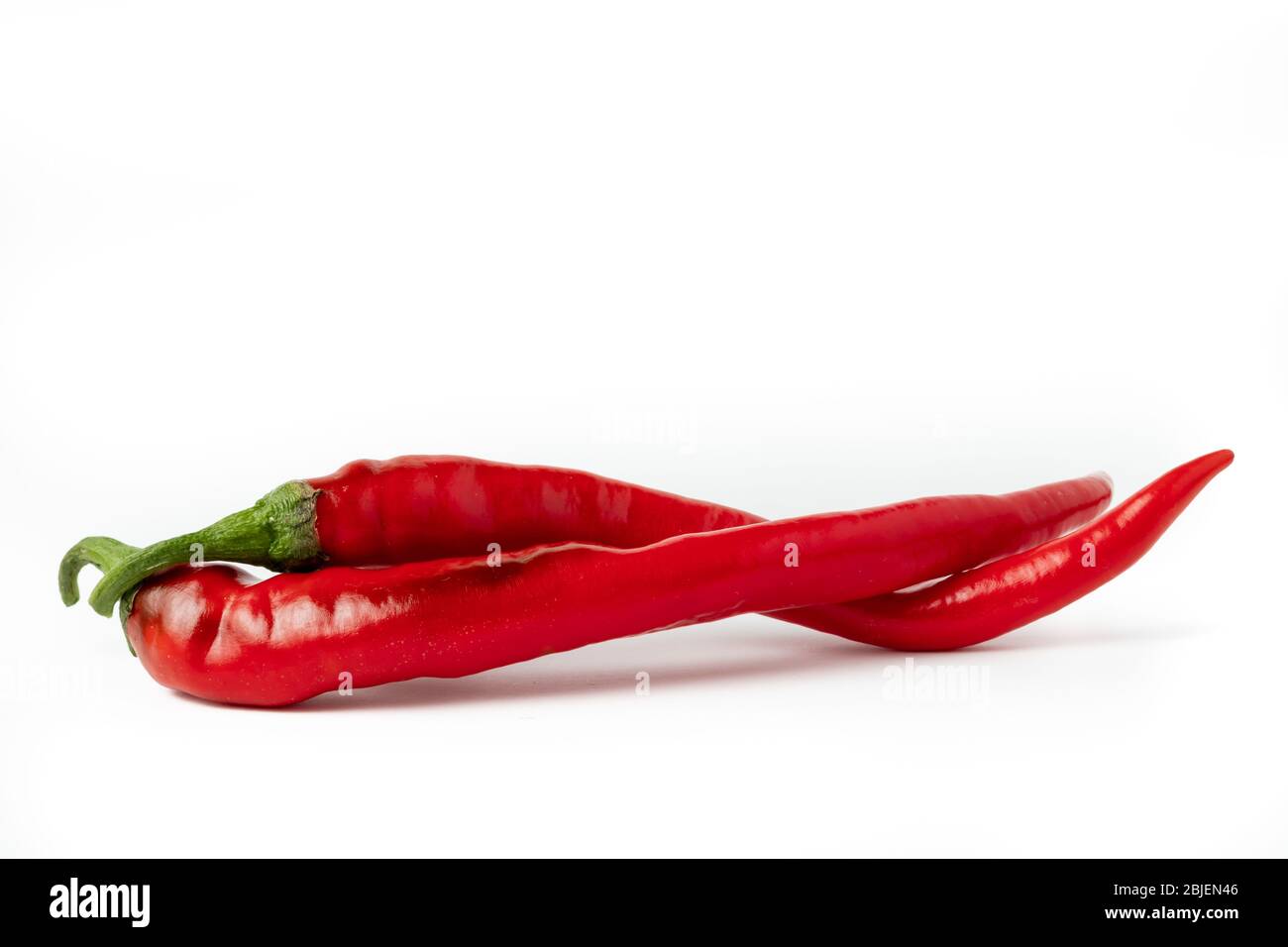 Red hot chili peppers isolated on white background Stock Photo - Alamy