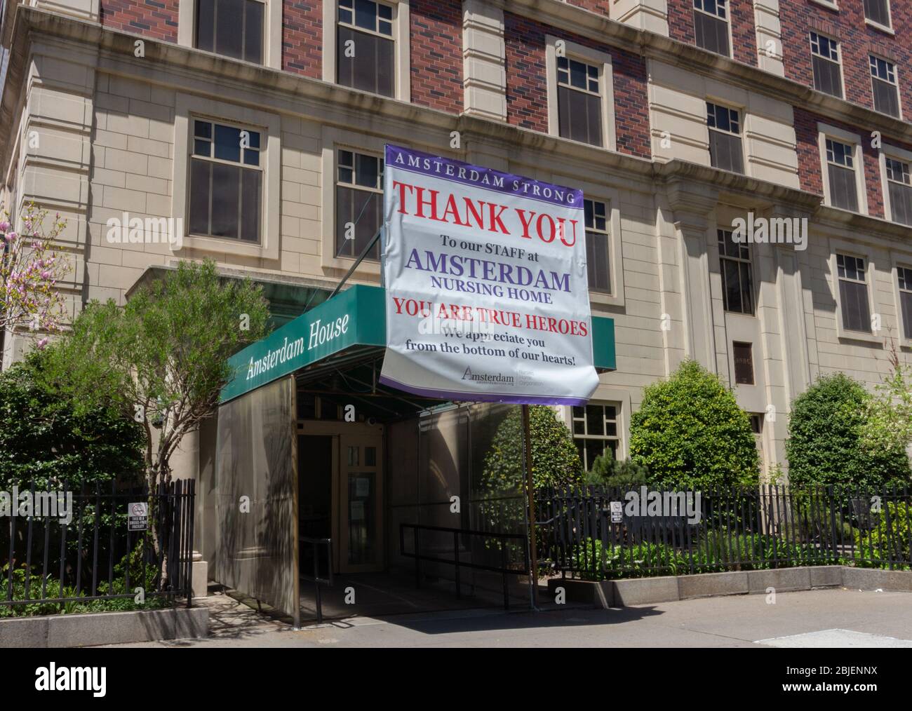 thank you sign to staff hanging in front of the Amsterdam Nursing Home. Nursing homes have been badly affected by the coronavirus or covid-19 pandemic Stock Photo