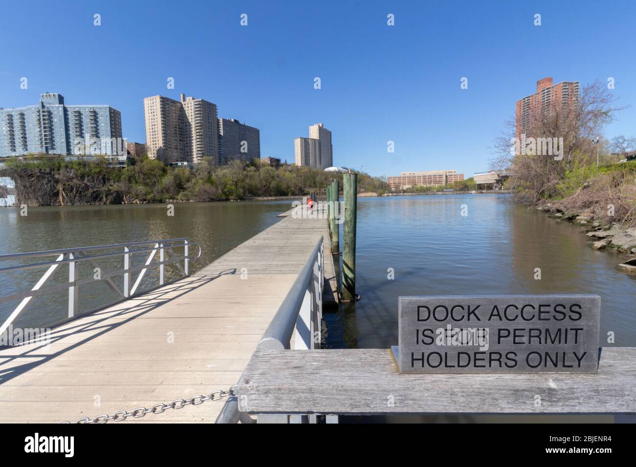 a sign is posted at the entrance to the dock for kayaks and canoes at the Muscota Marsh in Inwood stating dock access is for permit holders only Stock Photo