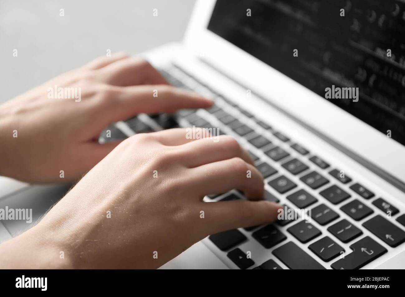 Programmer using laptop, closeup Stock Photo
