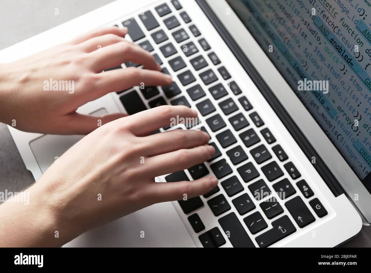 Programmer using laptop, closeup Stock Photo