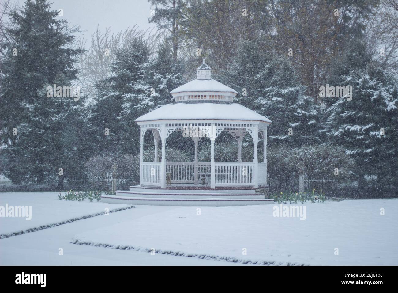 Snowy wedding day chapel,gazebo and cottage Stock Photo