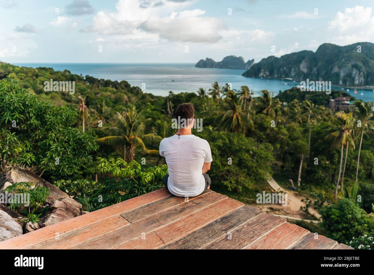 Back view young traveling man hi-res stock photography and images - Alamy
