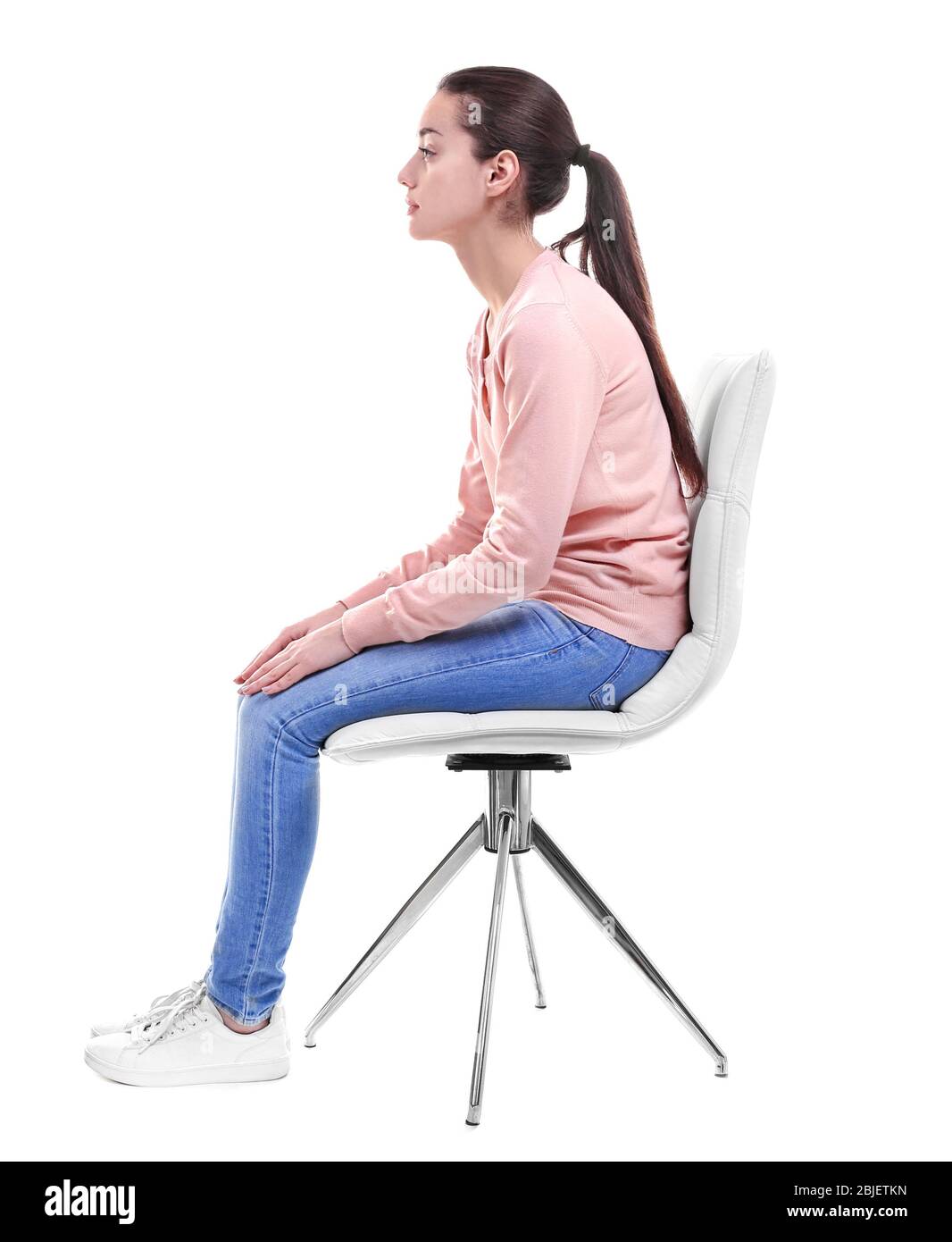 Posture concept. Young woman sitting on chair against white background ...
