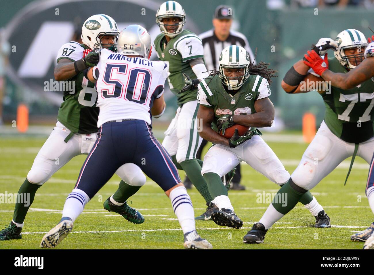 October 20, 2013: New York Jets running back Chris Ivory (33) carries the ball up the middle during the second half of a week 7 AFC East matchup betwe Stock Photo
