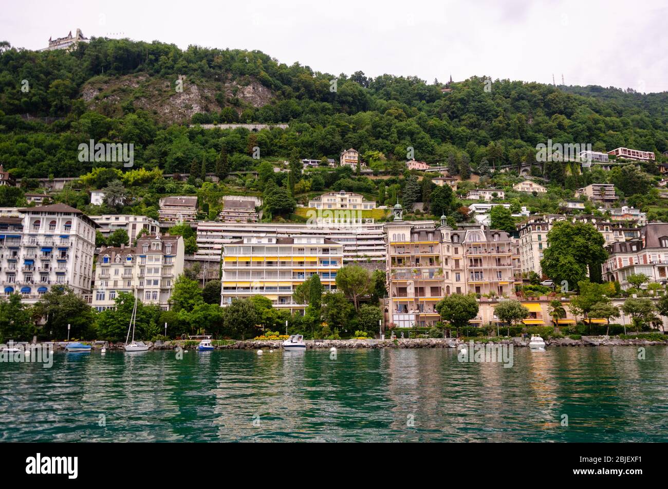 View of Lake Geneva and the shoreline while on the cruise boat from Villeneuve CGN to Veytaux, Switzerland Stock Photo