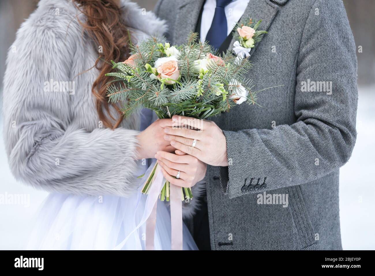 Happy wedding couple outdoors on winter day, closeup Stock Photo - Alamy