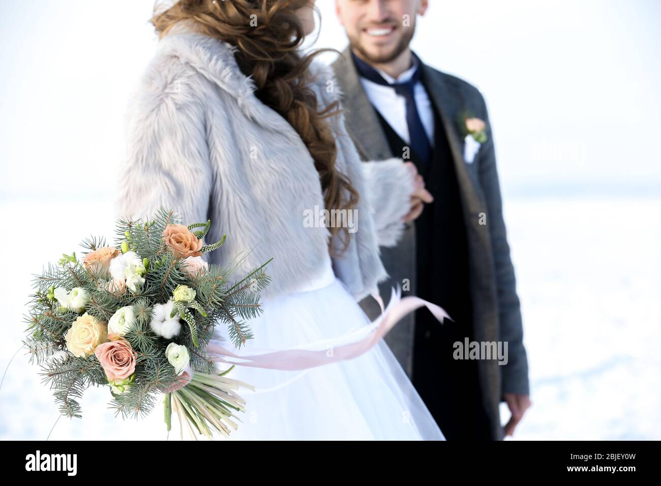 Happy wedding couple outdoors on winter day, closeup Stock Photo - Alamy