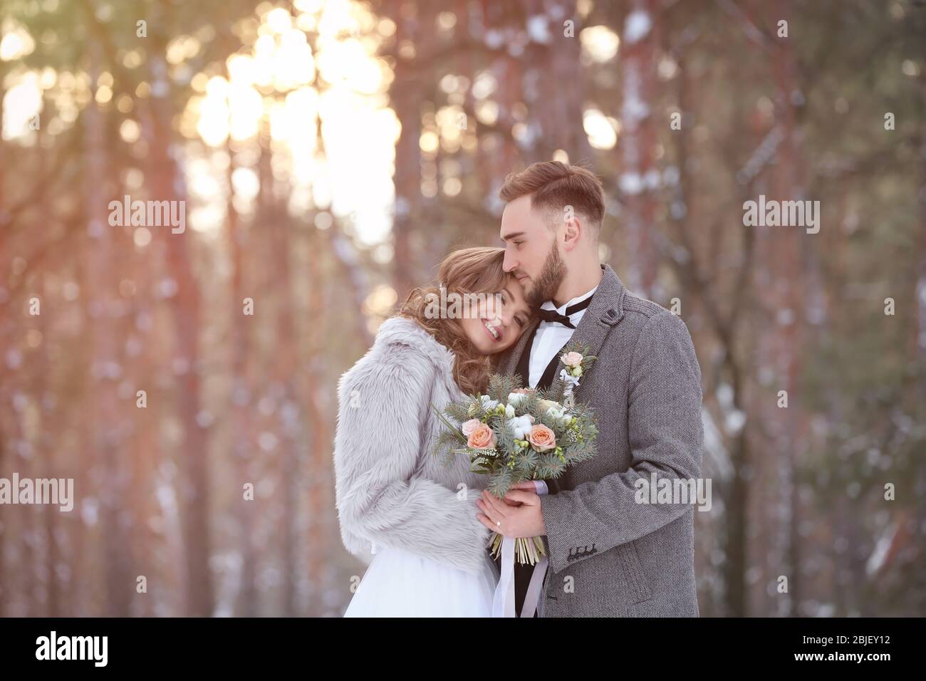 Happy wedding couple outdoors on winter day Stock Photo - Alamy