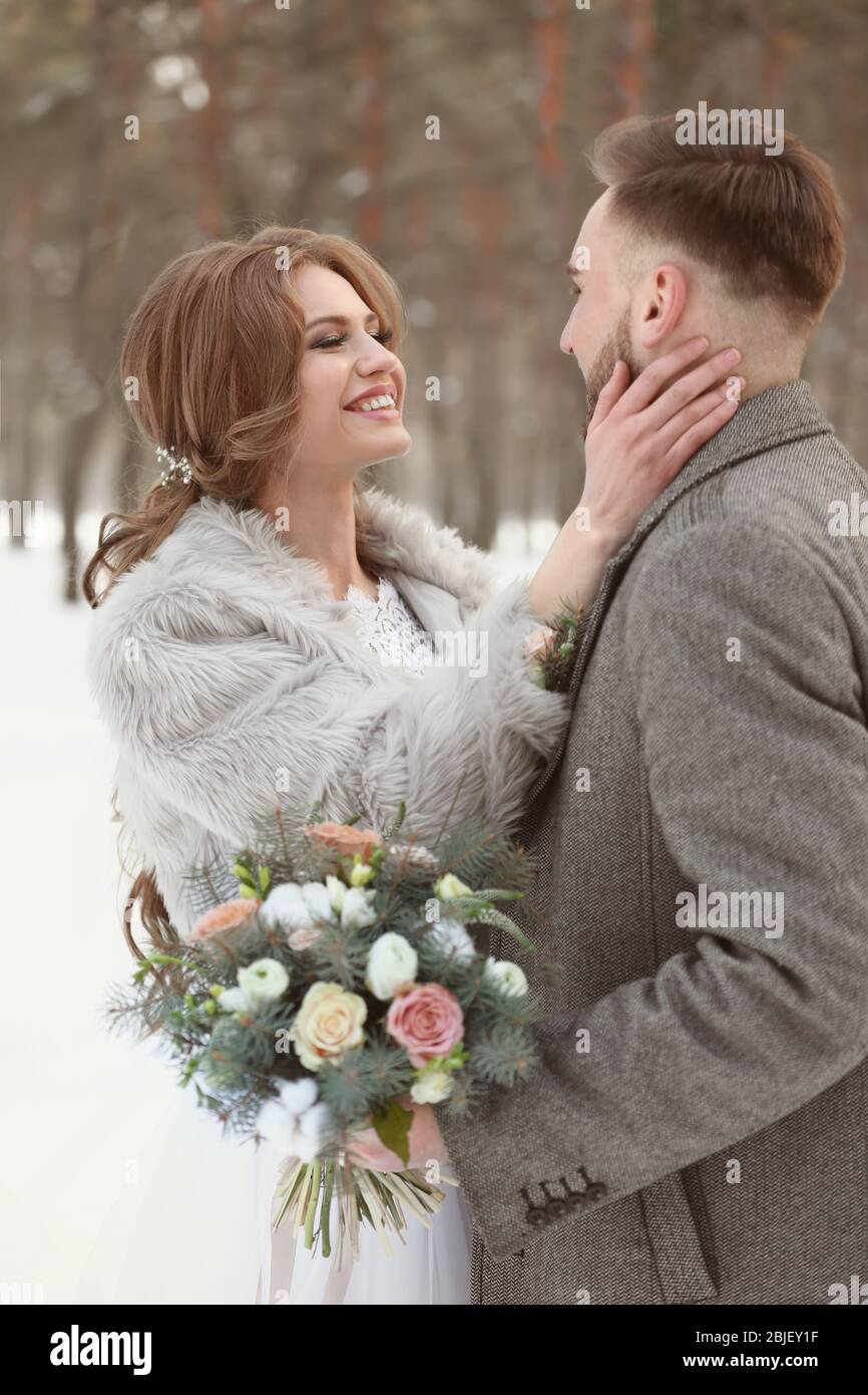 Happy wedding couple outdoors on winter day Stock Photo - Alamy