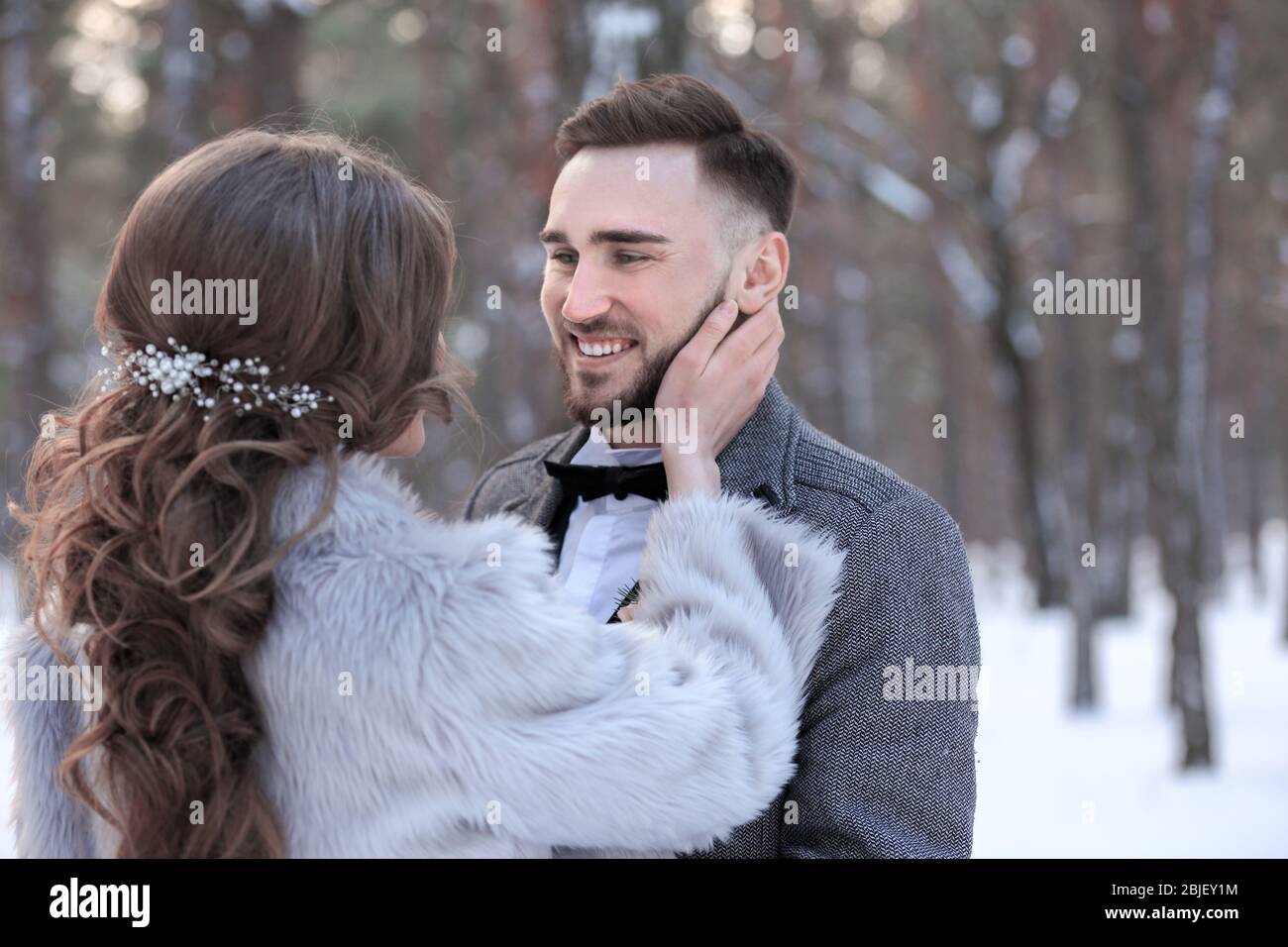 Happy wedding couple outdoors on winter day Stock Photo - Alamy