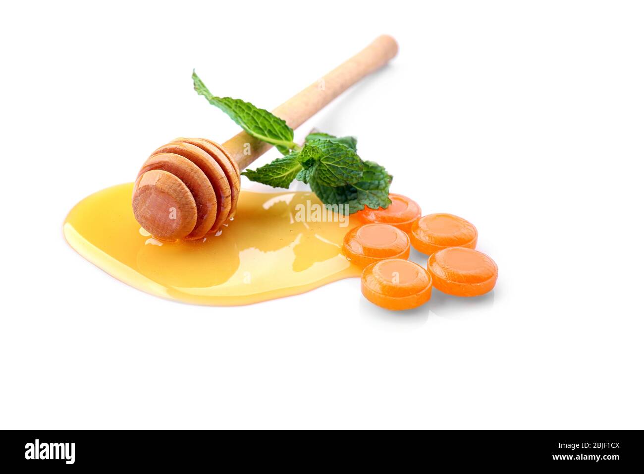 Cough drops with honey and mint on white background Stock Photo