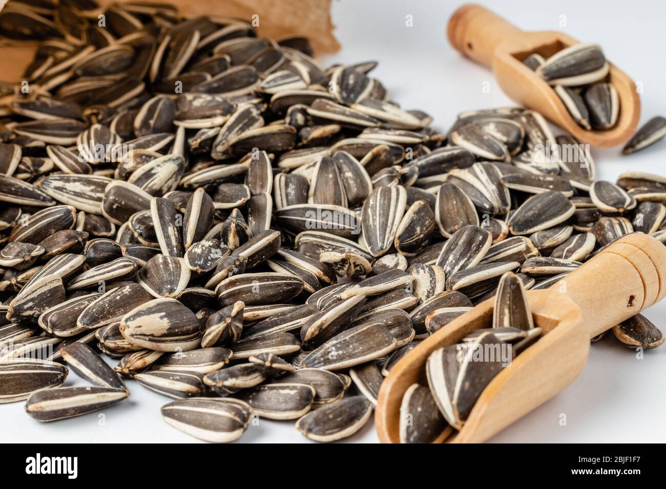 Large striped sunflower seeds with shell texture background Stock Photo