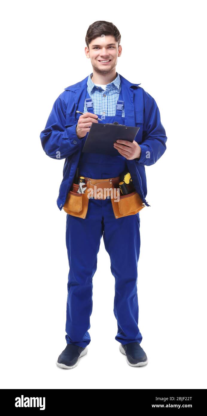 Plumber in uniform holding clipboard on white background Stock Photo