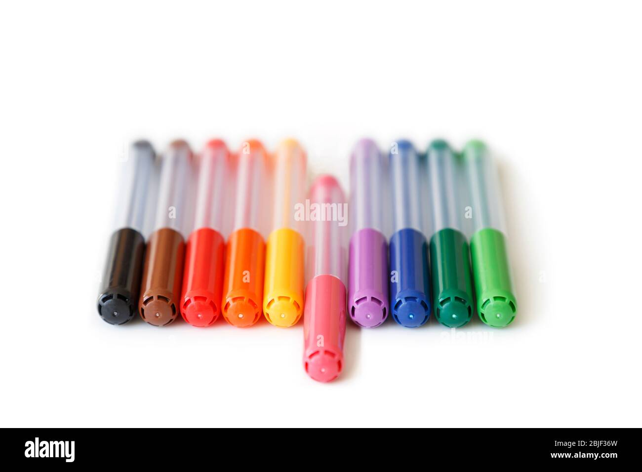 Close-up of set of colorful rainbow colored marker pens in a row, low angle  view. Pink marker in the middle is apart. Concept of standing out Stock  Photo - Alamy