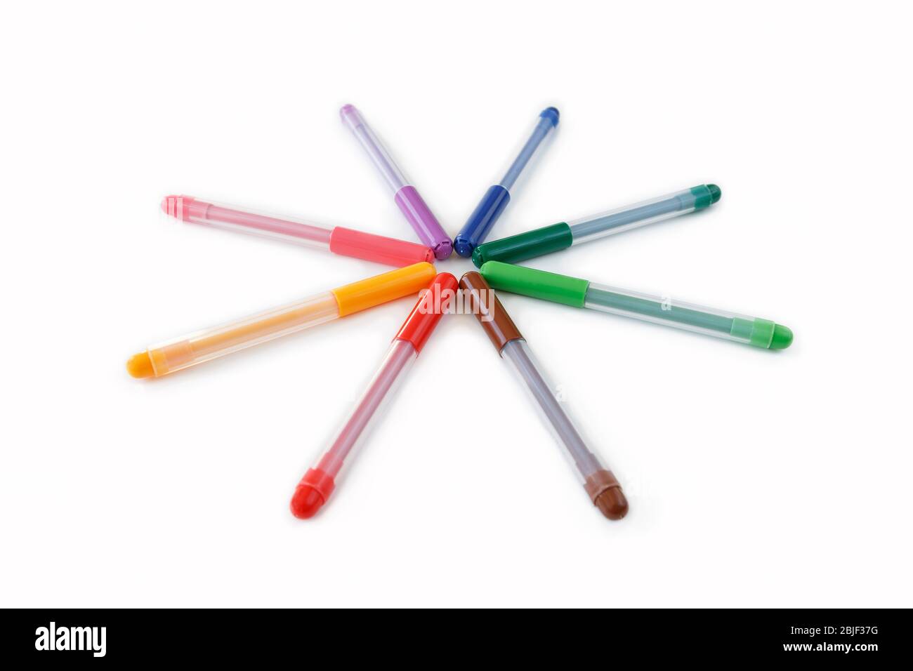Close-up of set of colorful rainbow colored marker pens, low angle view. Isolated on white background with clipping path. Stock Photo