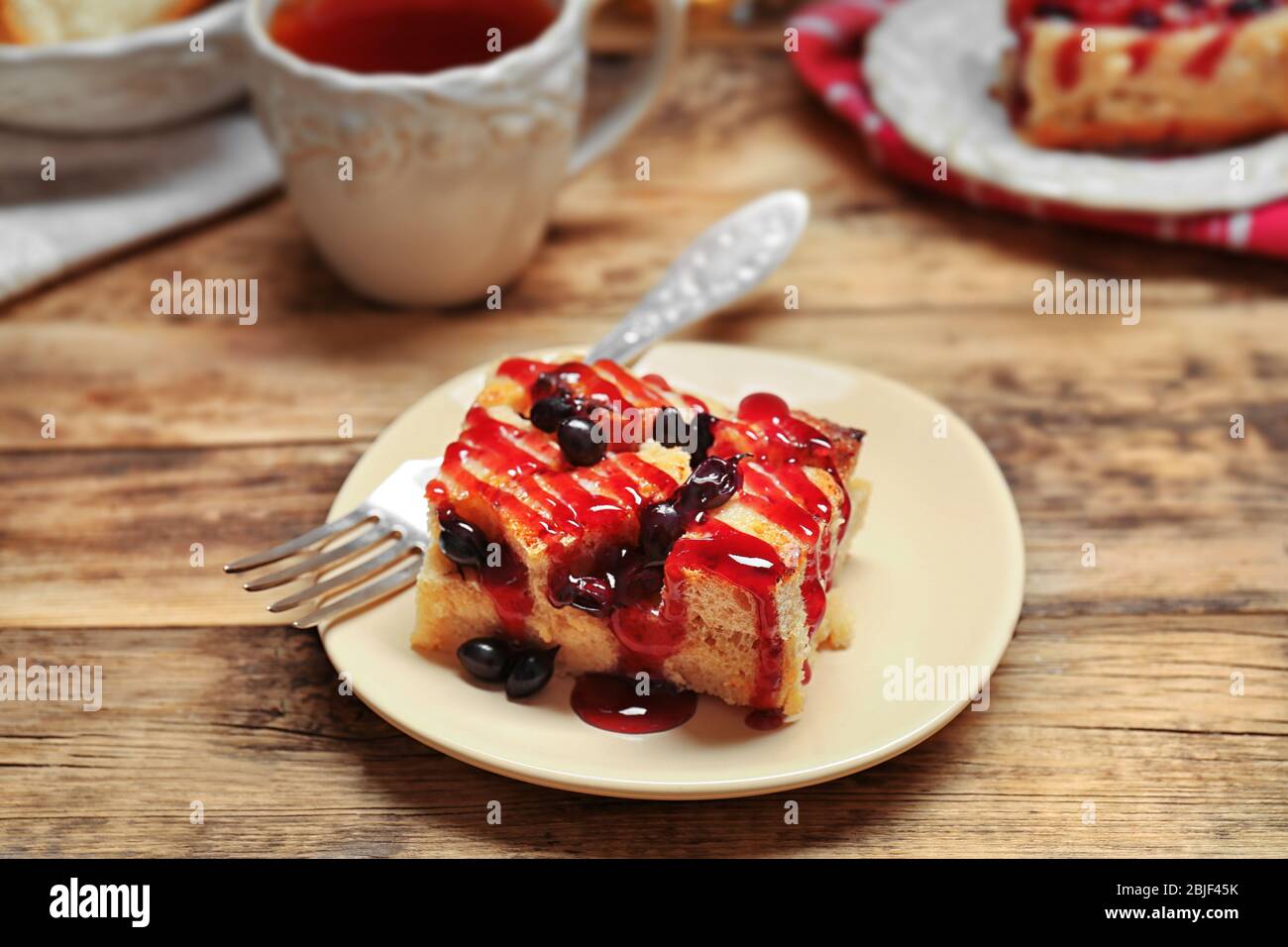 Delicious bread pudding with currant and jam on plate Stock Photo