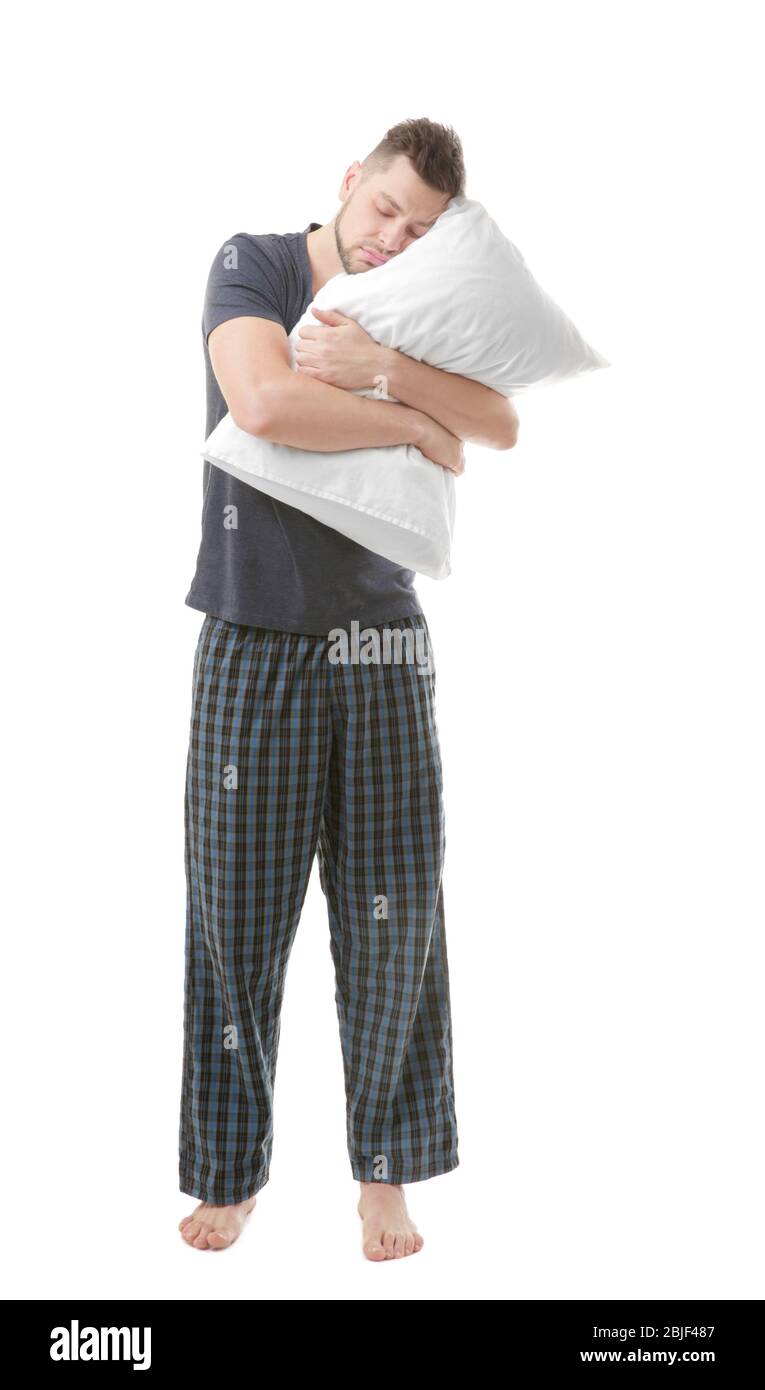 Sporty Man. Tired Male Wearing Pajamas And Keeping Head On Soft Pillow  While Making Fist On Left Hand Stock Photo, Picture and Royalty Free Image.  Image 91463537.