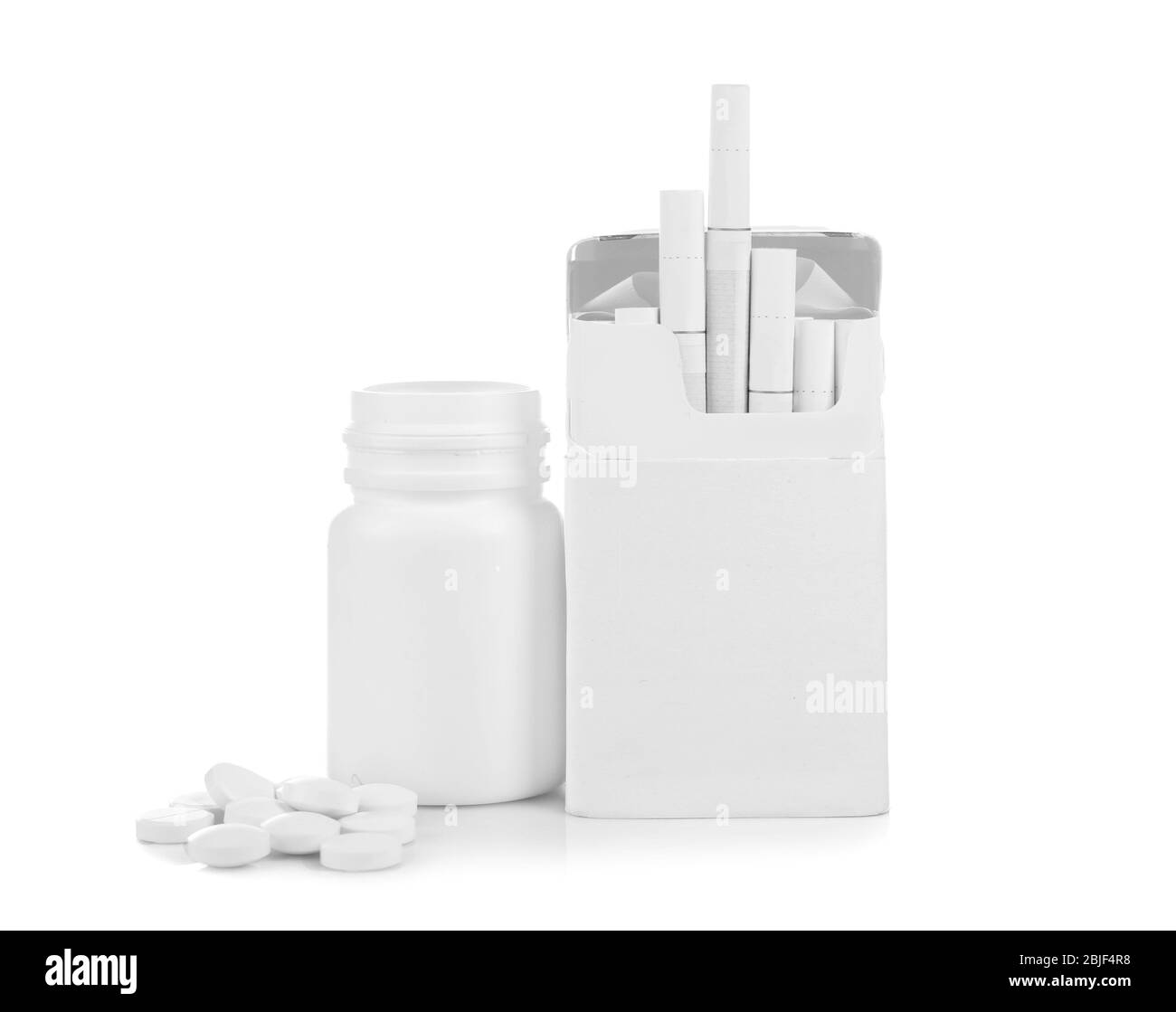 Pack of cigarettes and pills isolated on white Stock Photo