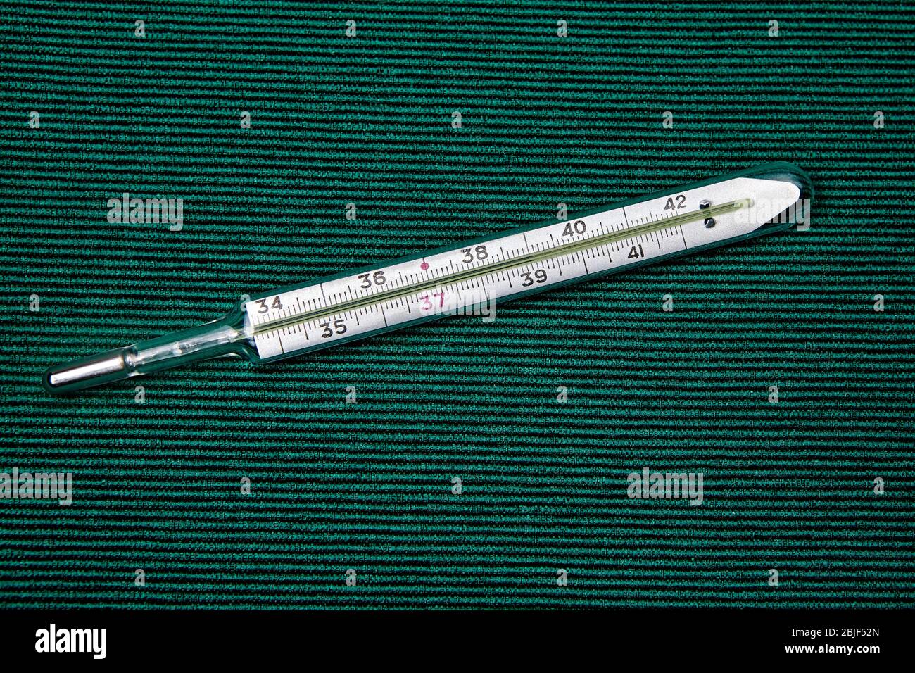 The scale of a mercury thermometer indicates high body temperature