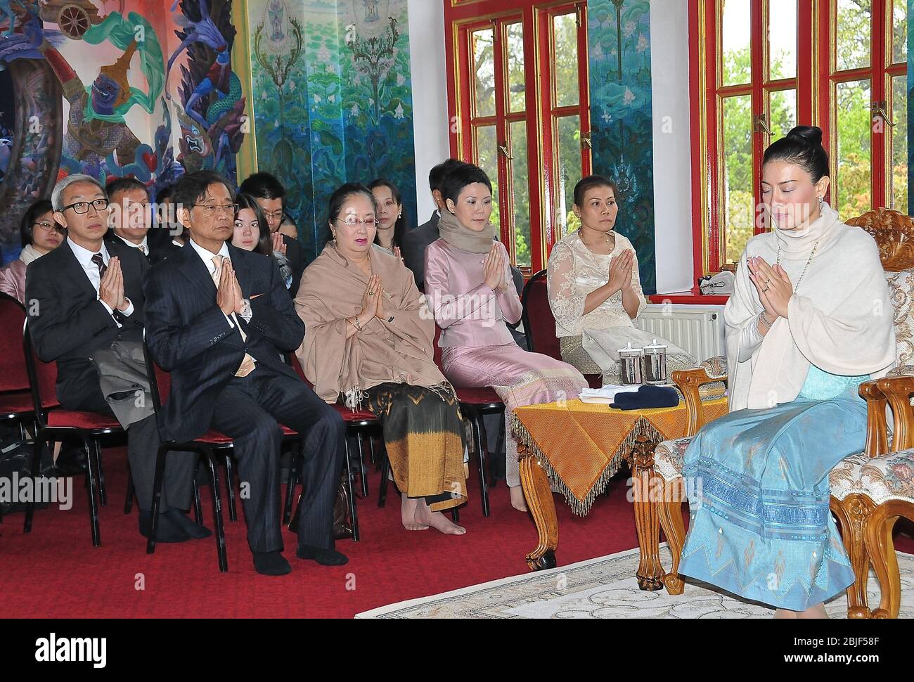 Prince Dipangkorn Rasmijoti was born on 29 April 2005 at Siriraj Hospitalin Bangkok.On 15 June 2005 king Bhumibol Adulyadej proclaimed the prince's name ,his Mother is Srirasmi Suwadee the kings third legal wife . She visited the UK and brought her son to a blessing ceremony at the Buddhapadipa Thai Temple in Wimbledon , London ,UK and after the ceremony went to the Temple hall to meet the children and the teachers of the Thai School in Wimbledon .She presented food to the monks and meet the children and there teachers . Stock Photo