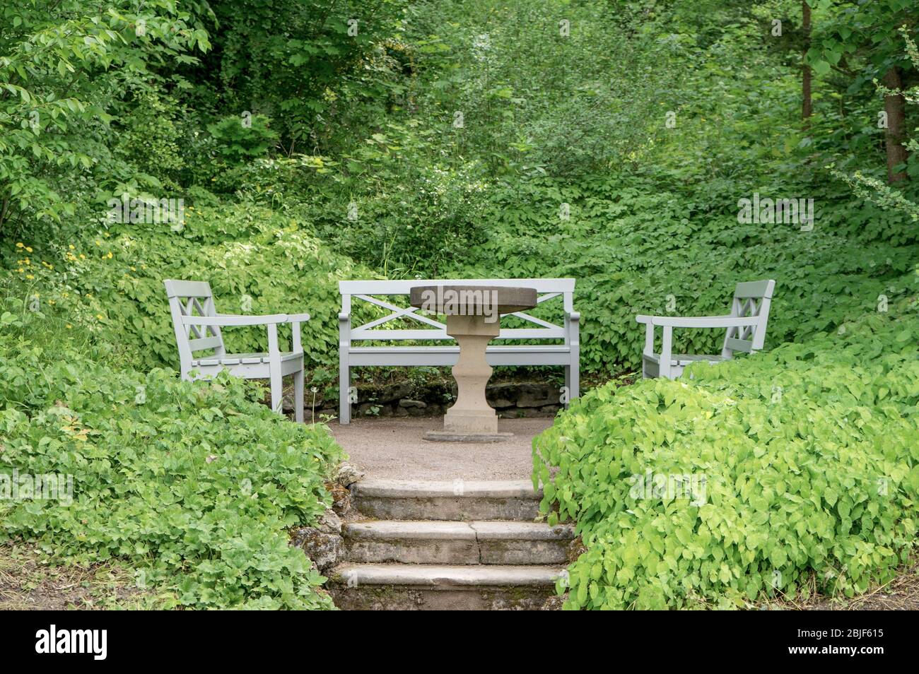 Benches and table in the park at Goethe's garden house in Weimar Stock Photo