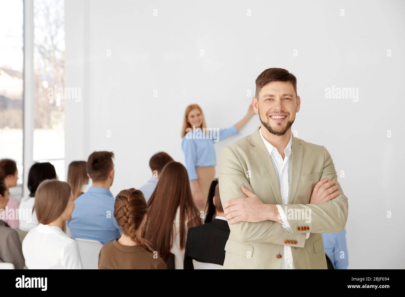 Young man at business presentation Stock Photo - Alamy