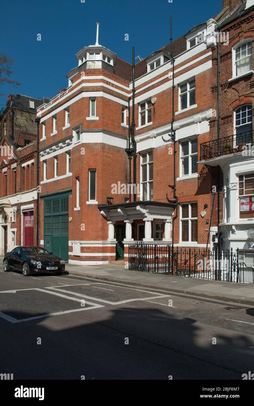 Arts & Crafts Victorian Architecture Red Brick West Kensington 22 Avonmore Road, Hammersmith, London W14 8RU by James Maclaren Stock Photo