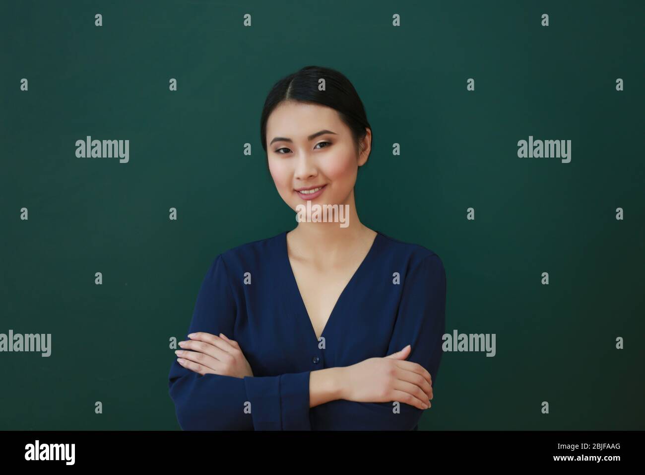 Portrait of Asian female teacher on blackboard background Stock Photo ...