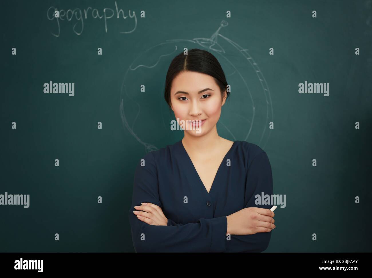 Portrait of Asian female teacher on blackboard background Stock Photo ...