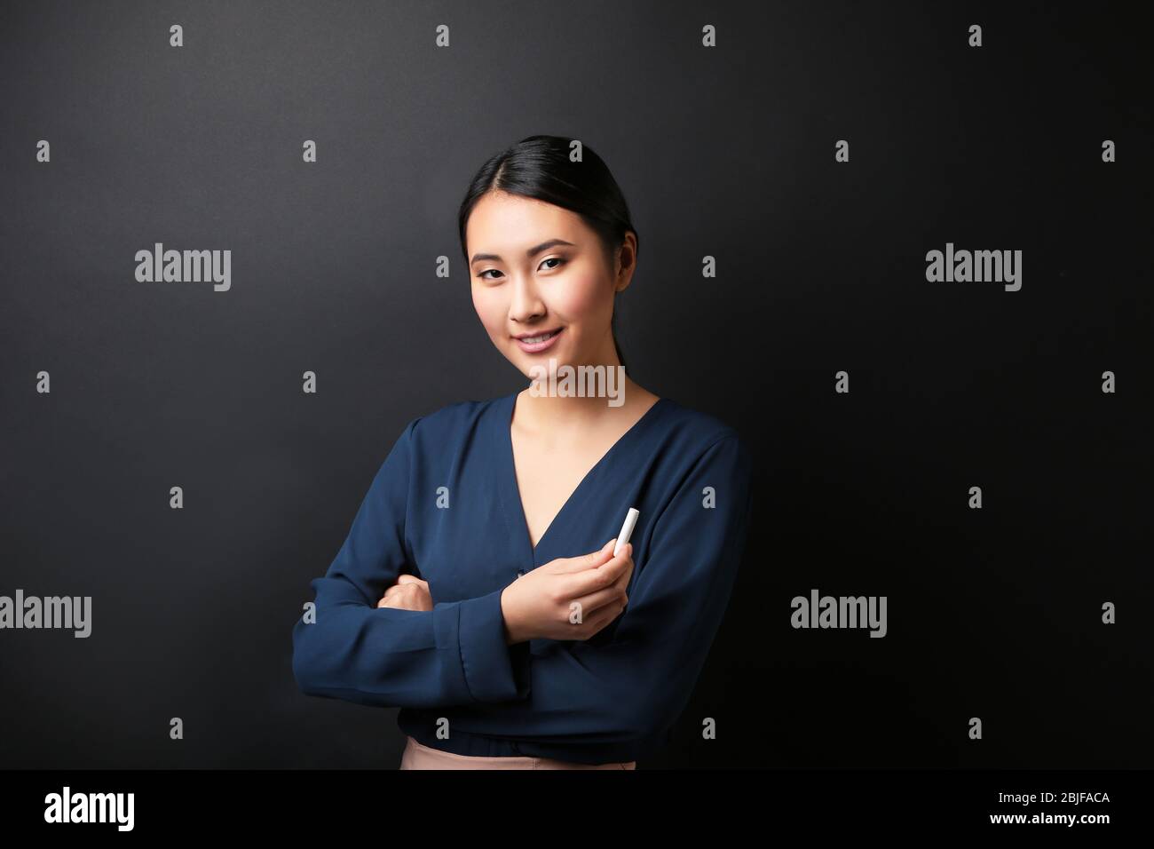 Portrait of Asian female teacher on blackboard background Stock Photo ...