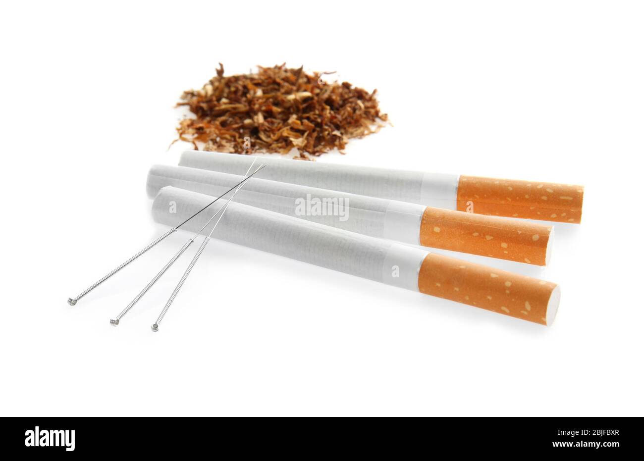 tobacco needles Cigarettes with needles and tobacco on white background Stock Photo