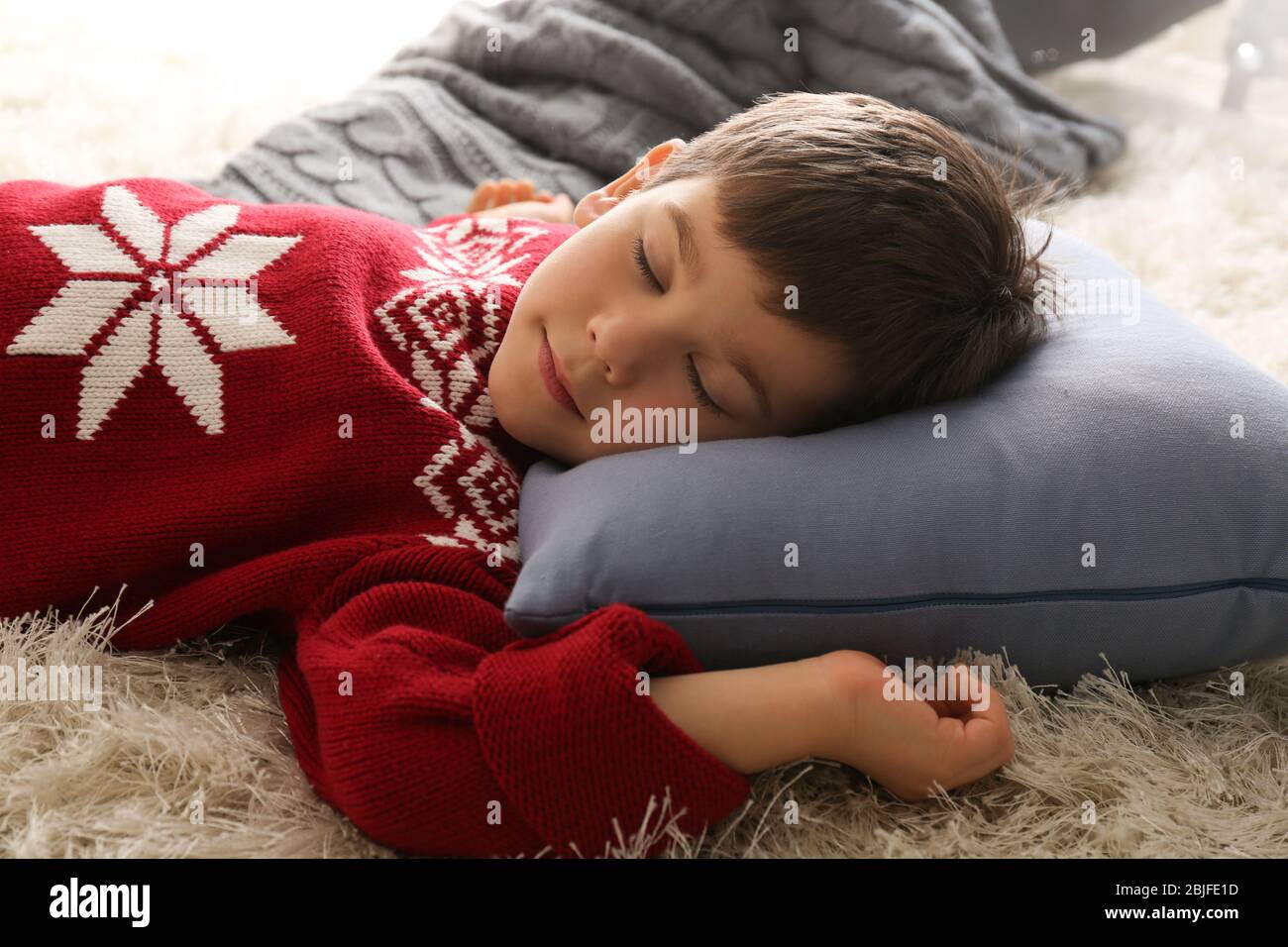 Cute little boy sleeping on floor at home Stock Photo Alamy