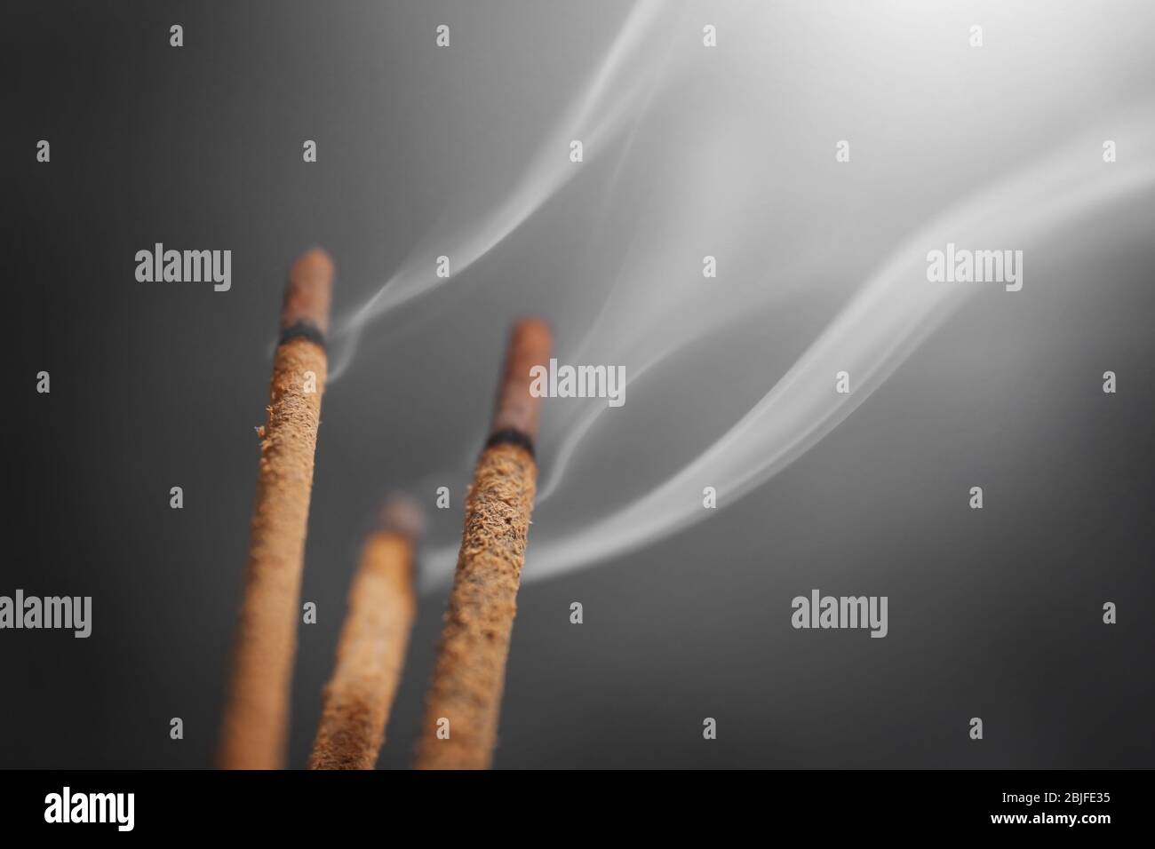 Aroma sticks with smoke Stock Photo - Alamy