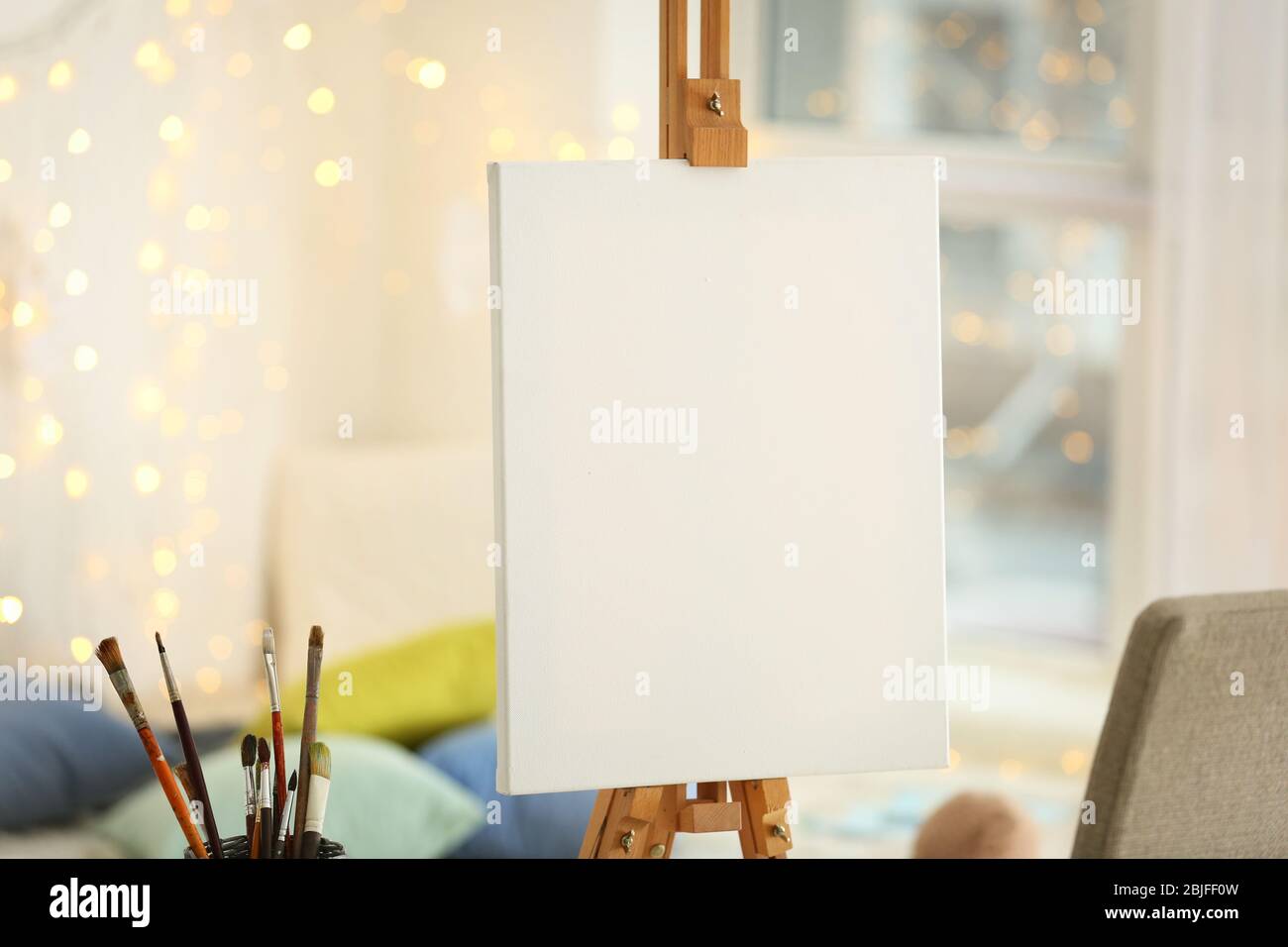 Clean canvas on easel in workroom Stock Photo Alamy
