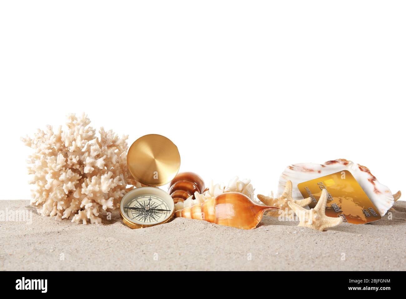Sand with credit card and coral on white background Stock Photo
