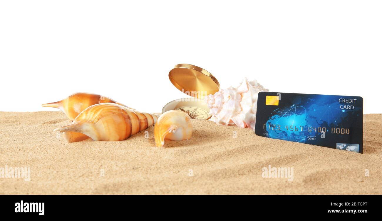 Sand with credit card and seashells on white background Stock Photo