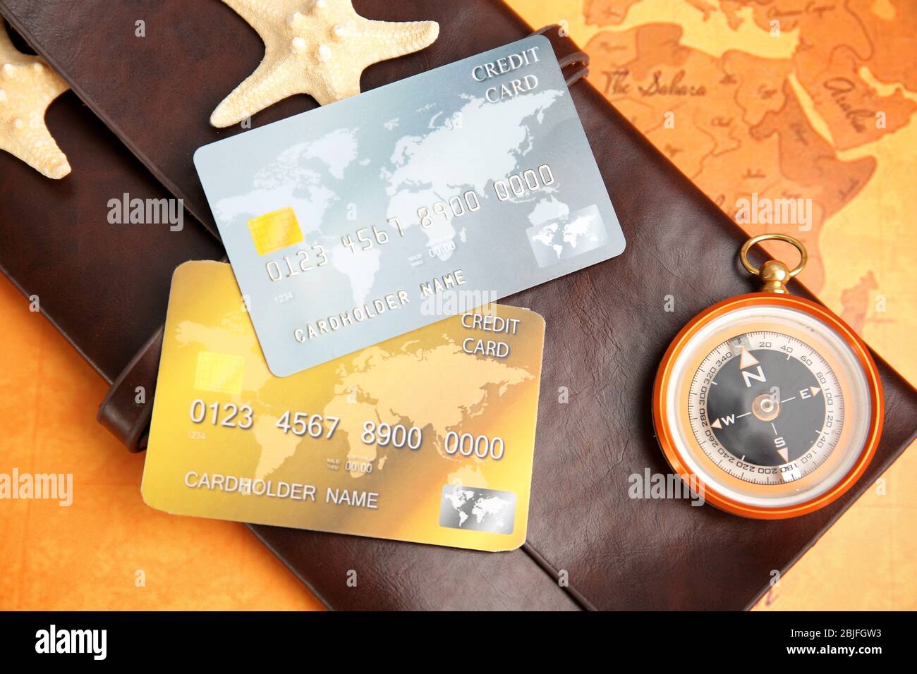 Credit cards with wallet on world map background Stock Photo