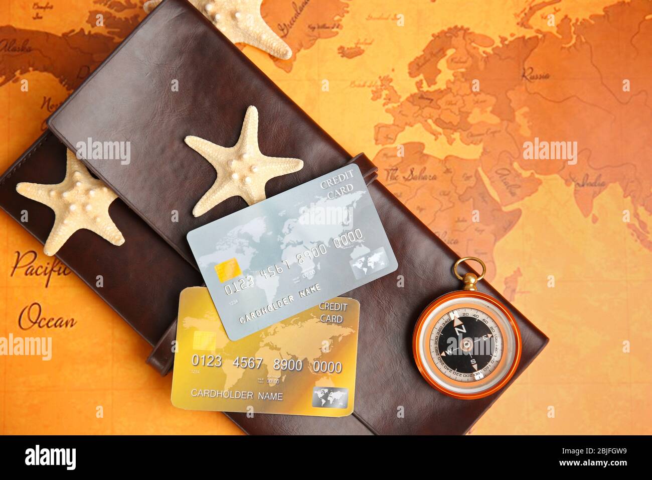 Credit cards with wallet on world map background Stock Photo
