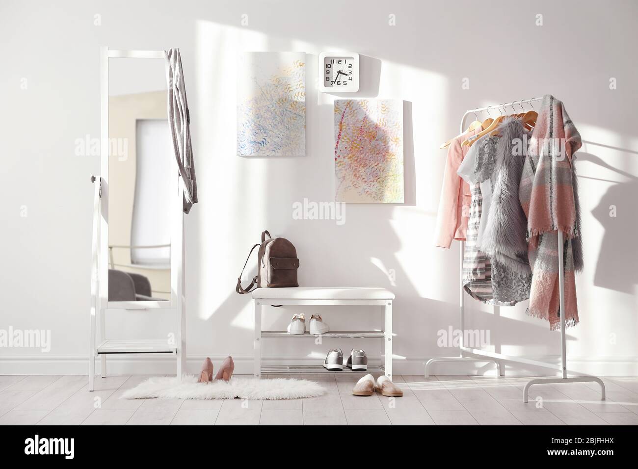 Modern hall interior with hanging clothes Stock Photo - Alamy