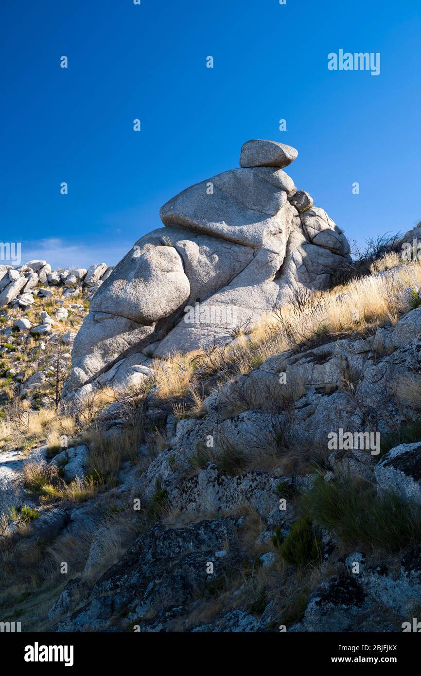 Serra da Estrela mountain range in the Natural Park. Glacial erratics boulders form interesting sculptures. Stock Photo