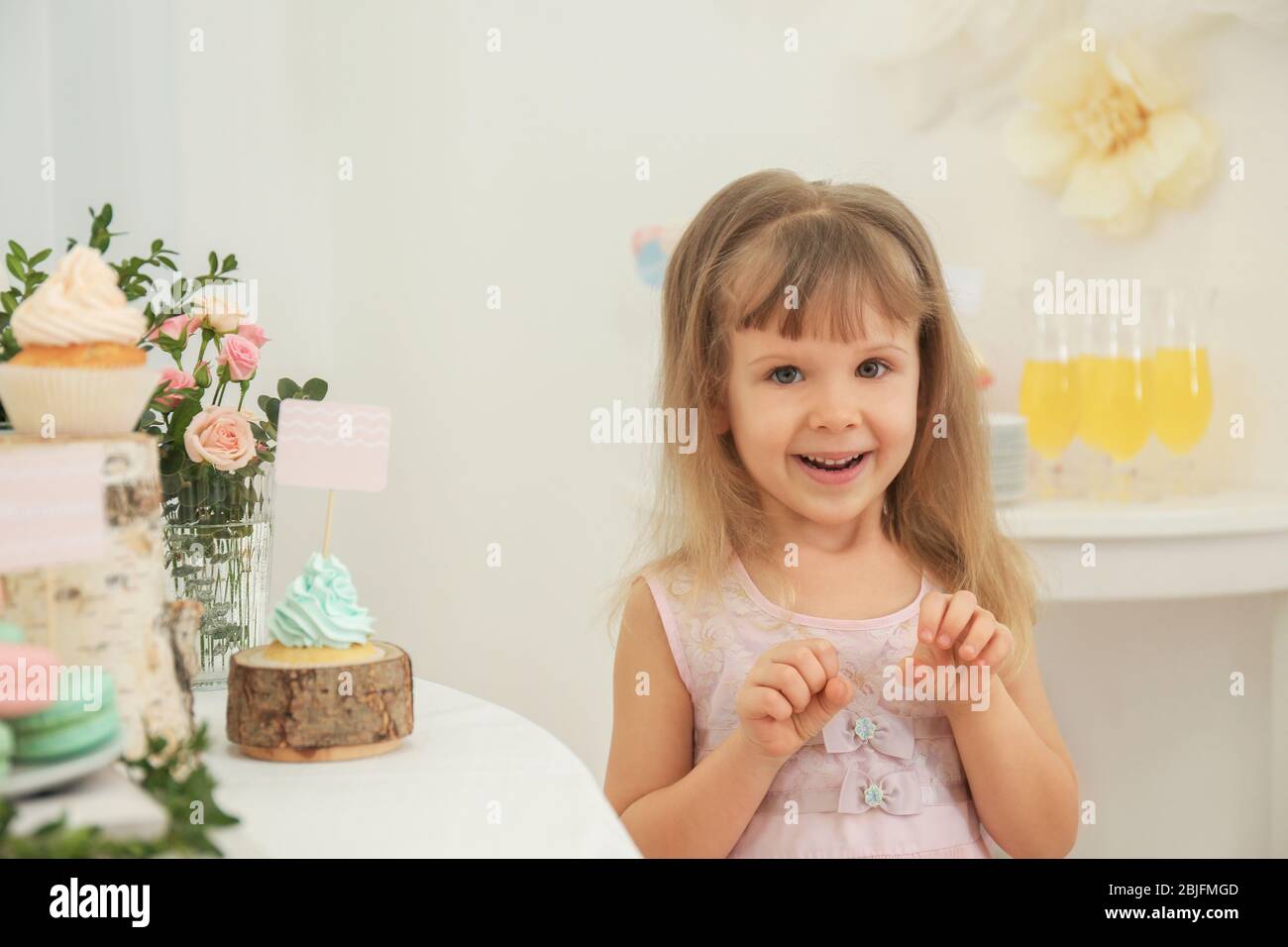 Cute Girl Near Table With Sweets Served For Party Stock Photo Alamy cute-girl-near-table-with-sweets-served-for-party-stock-photo-alamy