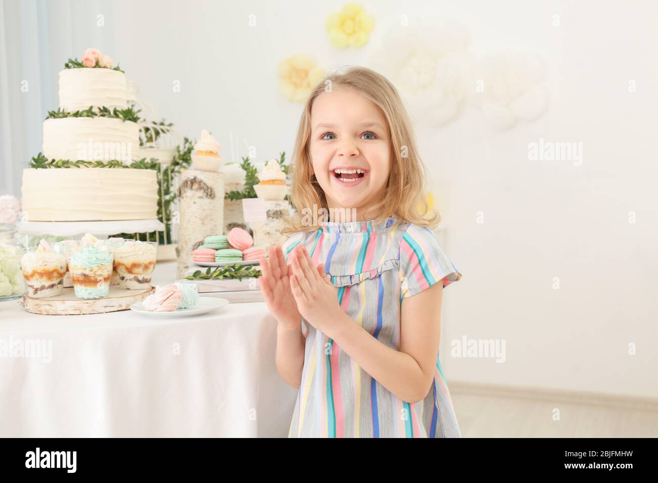 cute-girl-near-table-with-sweets-served-for-party-stock-photo-alamy
