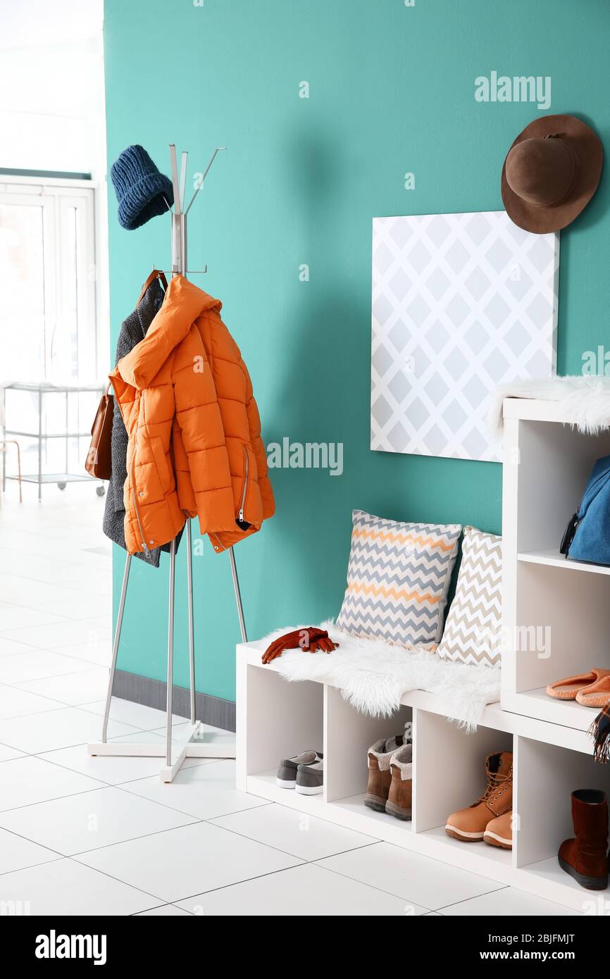 Modern hallway interior with hanging clothes Stock Photo - Alamy
