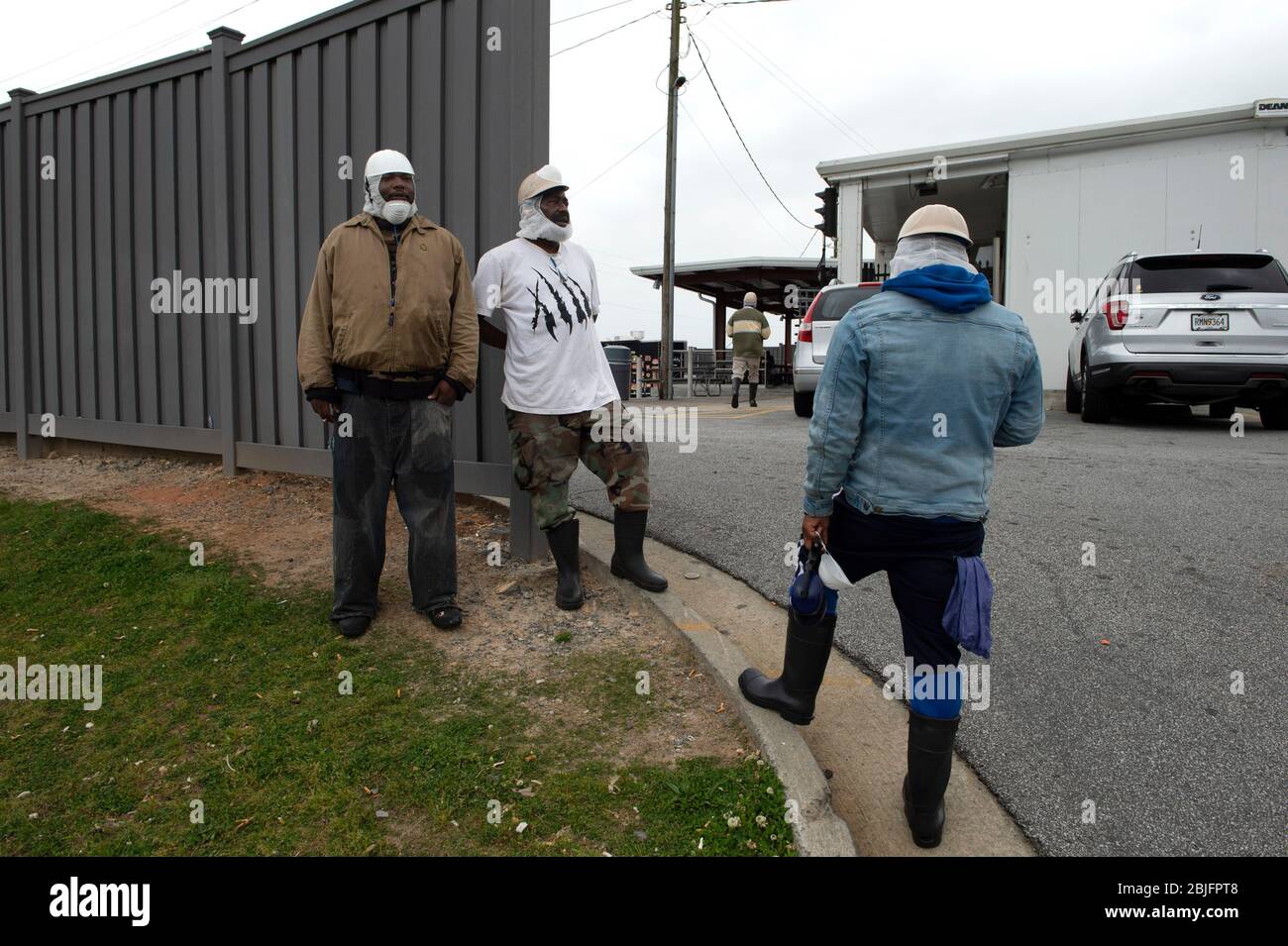 Marietta, GA, USA. 29th Apr, 2020. Employees of the Tip Top Poultry processing facility take a break from their jobs Ã”hanging chicken.Ã The company was thought to be responsible for listeria-contaminated chicken, which resulted in multiple product recalls in the U.S. and Canada in 2019. Credit: Robin Rayne/ZUMA Wire/Alamy Live News Stock Photo